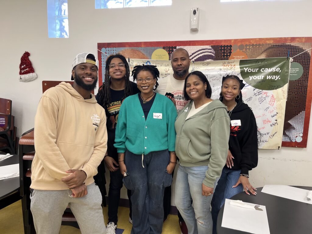 Photo of the Walls family volunteering with Feeding Tampa Bay.